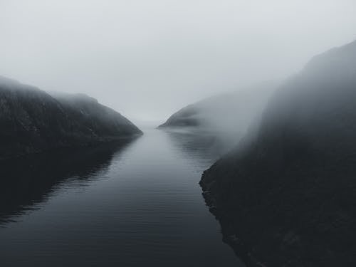 Lake in a Mountain Valley in Fog