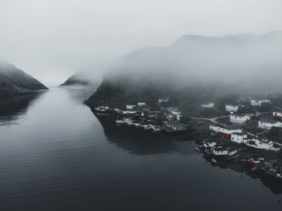 Fog rolling over a coastal village, photo by Erik Mclean on Pexels