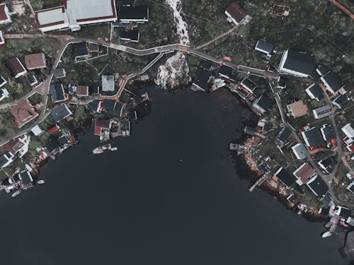 Aerial View of Village Sprawled on Lake Shore