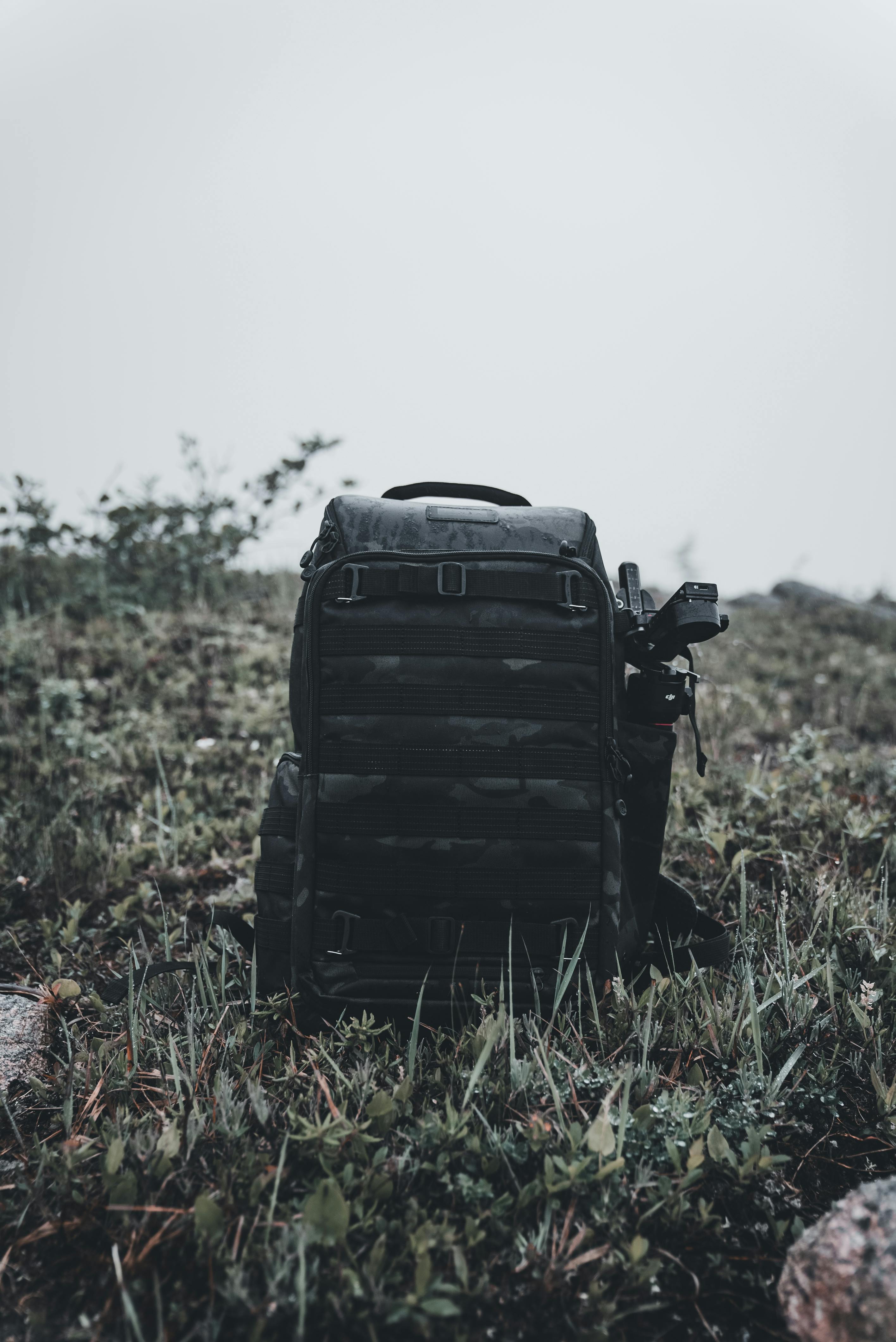 black backpack on grass