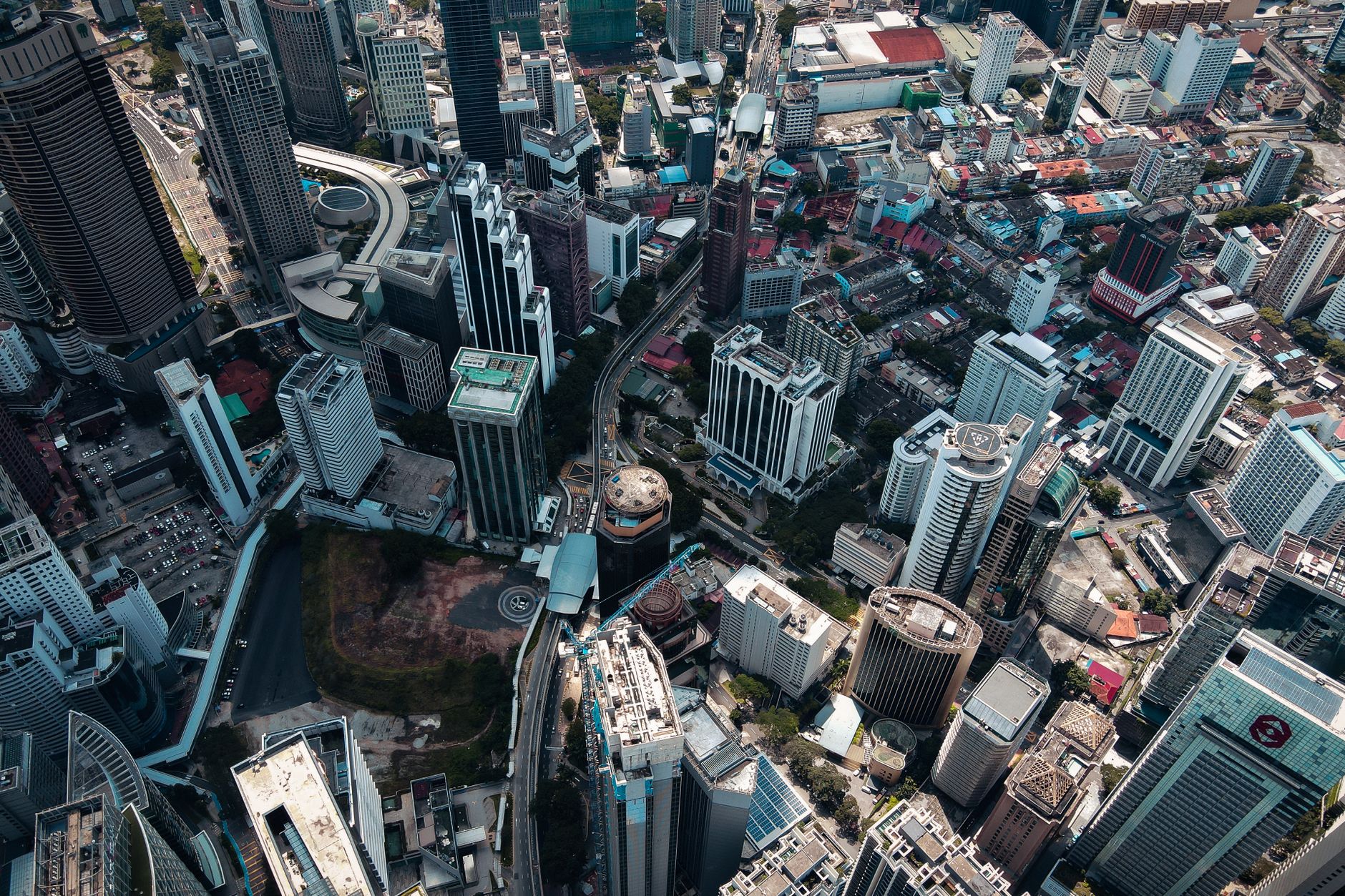Vibrant aerial view showcasing a bustling cityscape with diverse skyscrapers and urban layout.