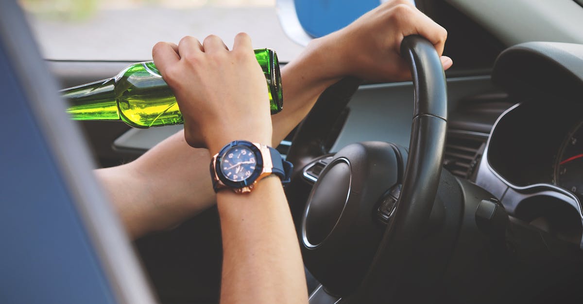 Person Driving and Drinking