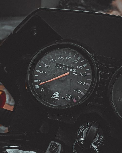 Free Detailed view of a motorcycle speedometer showing 31314.5 km and key dashboard features. Stock Photo