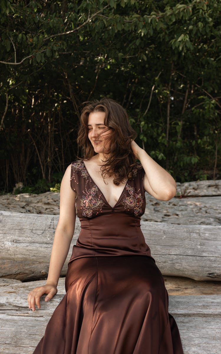 Woman Posing In Dress By The Forest