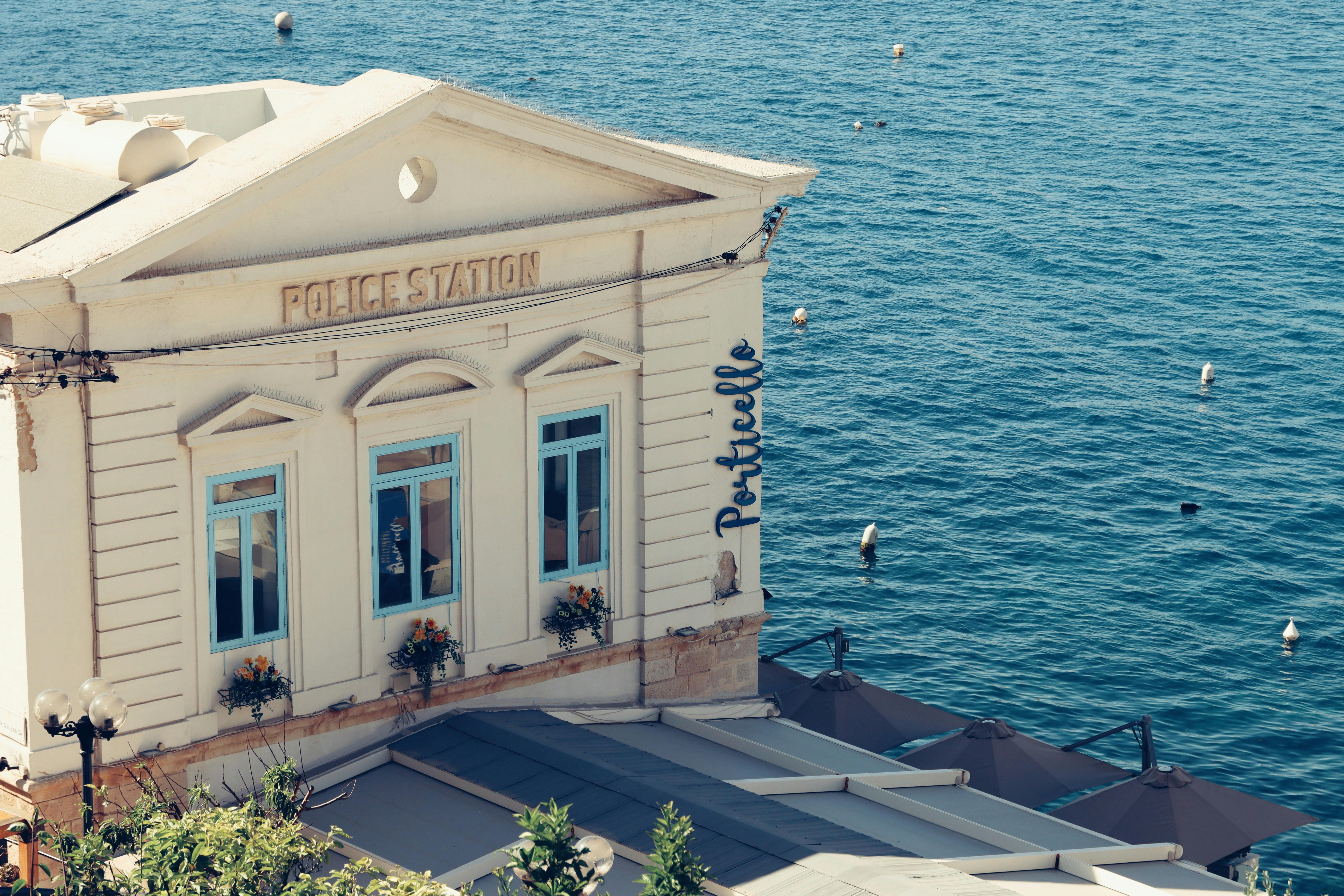 A charming seaside police station in Valletta, Malta, overlooking the ocean.