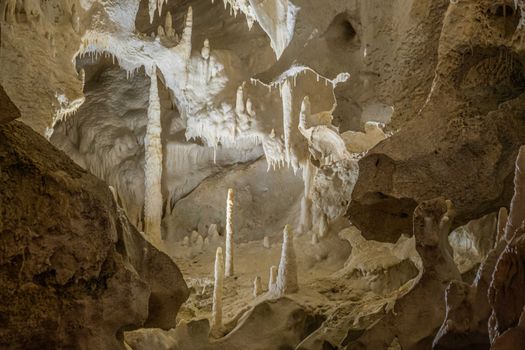 Stunning limestone cave interior showcasing stalactites and stalagmites in a natural wonder.