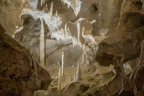Free Stunning limestone cave interior showcasing stalactites and stalagmites in a natural wonder. Stock Photo