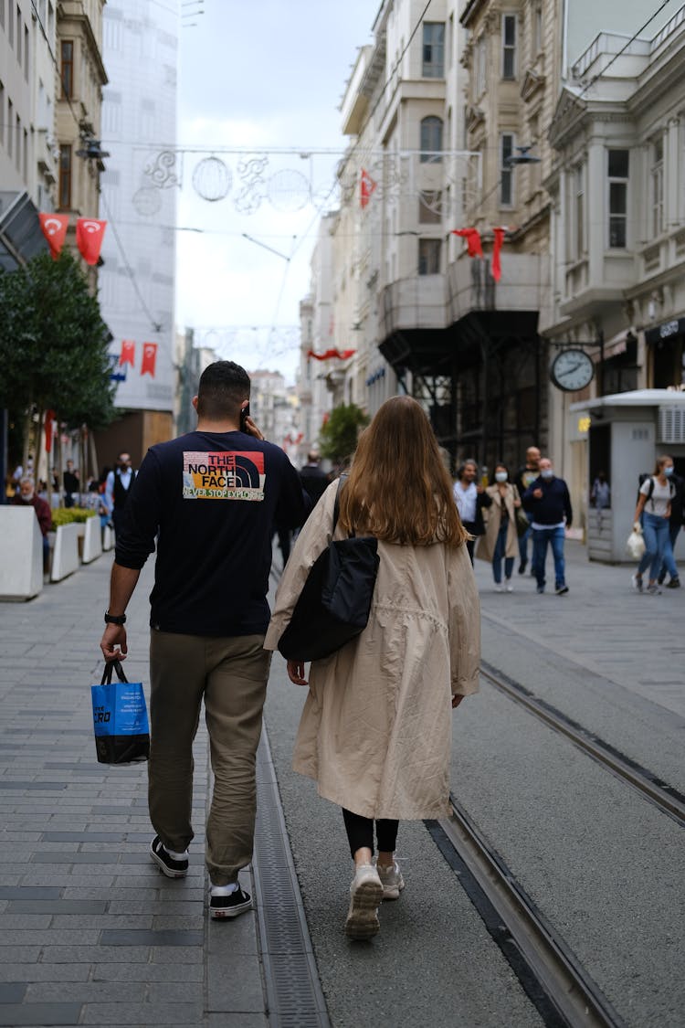 Young Couple Walking On A Street