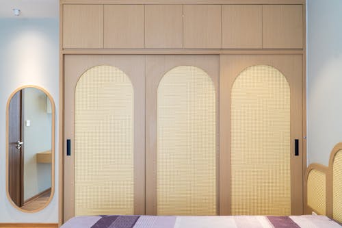 Free Bed and Wardrobe in a Hotel Room Stock Photo