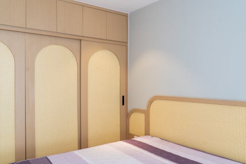 Free Bed and Wardrobe in a Hotel Room Stock Photo