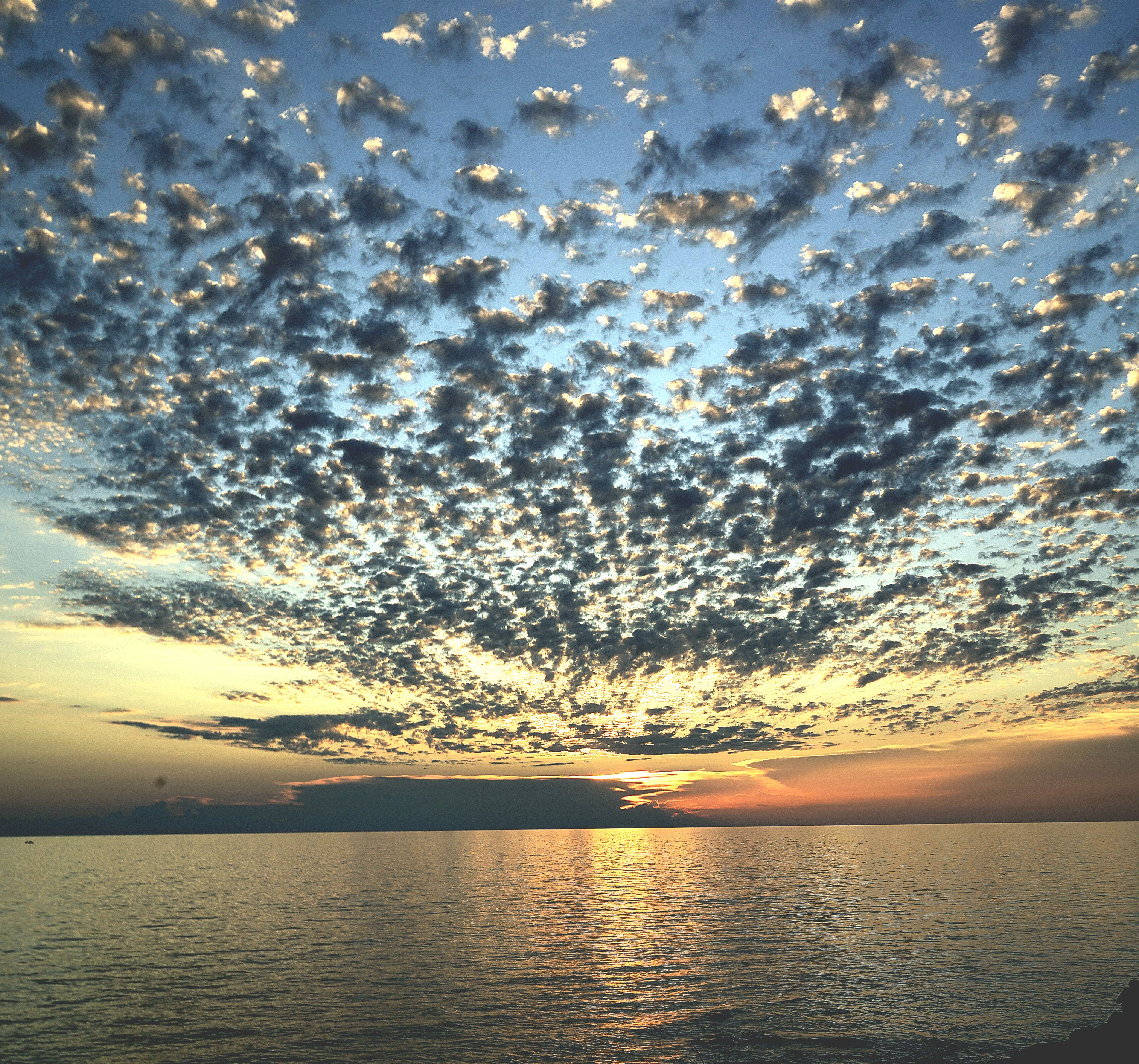 Clouds on Sky over Sea Coast at Sunset · Free Stock Photo