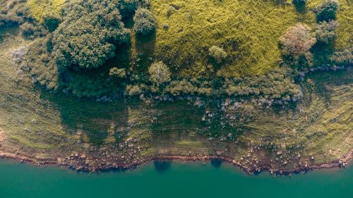Free Stunning aerial view showcasing the lush greenery and shoreline in Kandy, Sri Lanka. Stock Photo