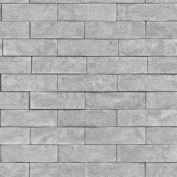 Close-up textured gray brick wall pattern, ideal for backgrounds.