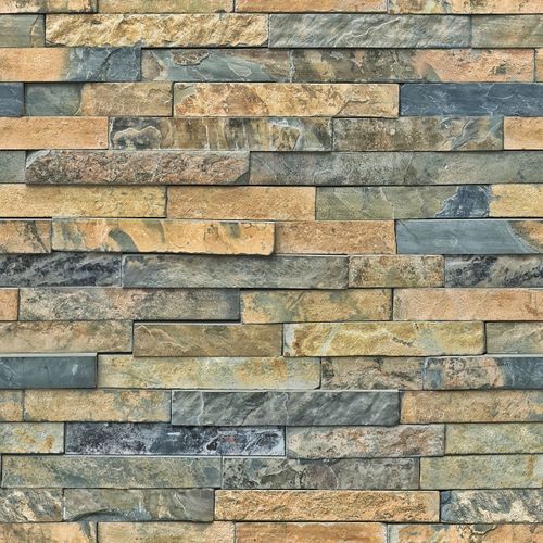 Free Detailed close-up of a natural stone brick wall showing texture and color variations. Stock Photo
