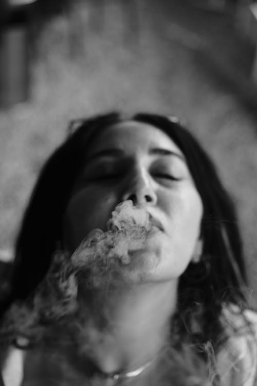 Portrait of a Woman Smoking a Cigarette in Black and White