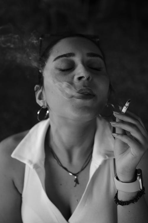 Woman Smoking a Cigarette in Black and White