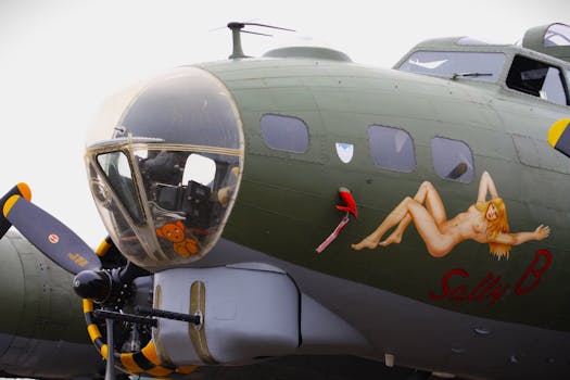 Detailed view of the nose art on a B-17 bomber at Duxford airfield.