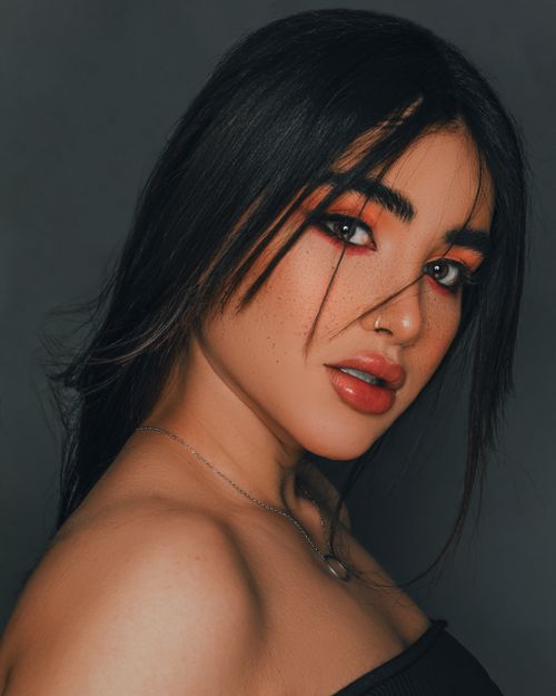 Free Intimate studio portrait of a fashionable brunette woman with striking makeup. Stock Photo
