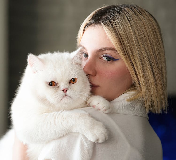 Portrait Of Woman With White Cat