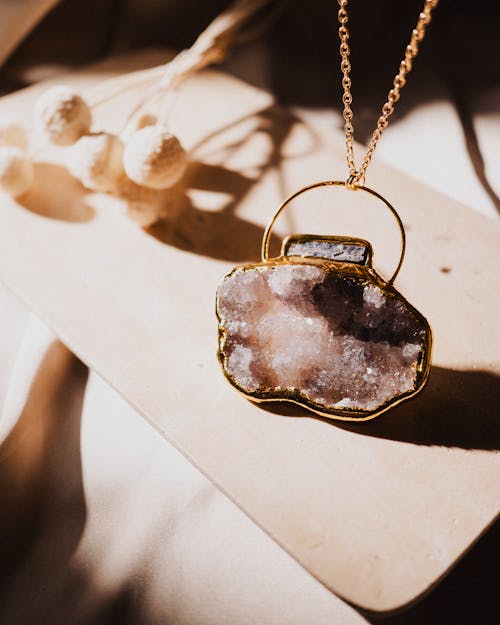 Close-up of a Pendant with a Precious Stone 