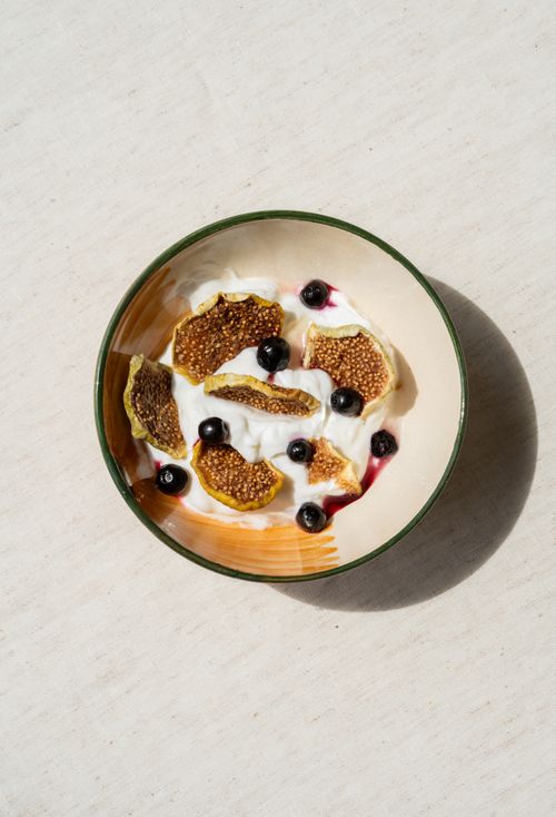 Free Delicious yogurt bowl with sliced figs and blueberries, a perfect healthy treat. Stock Photo