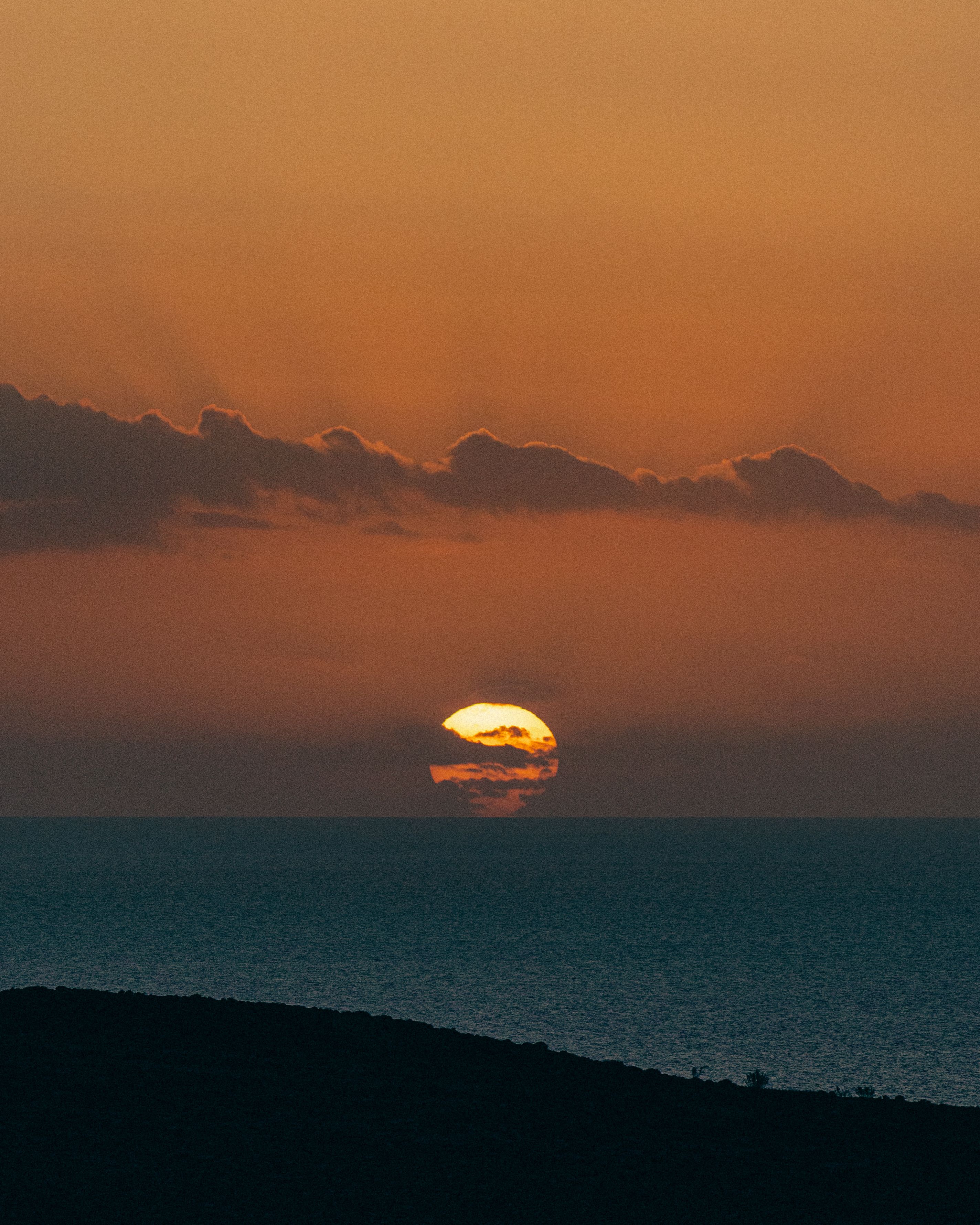Clouds on Yellow Sky over Sea Shore at Sunset · Free Stock Photo