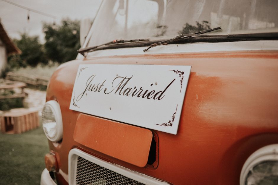 wedding couple boarding decorated bus with guests - Bus hire for weddings wedding couple boarding decorated bus with guests - Bus hire for weddings