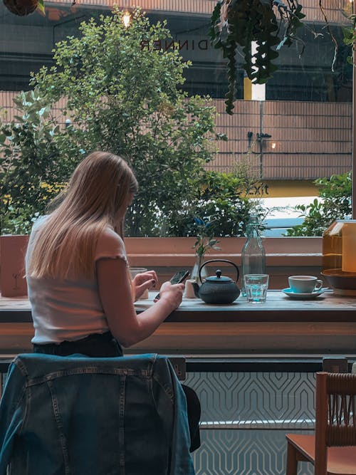 Blonde Woman Sitting at Cafe