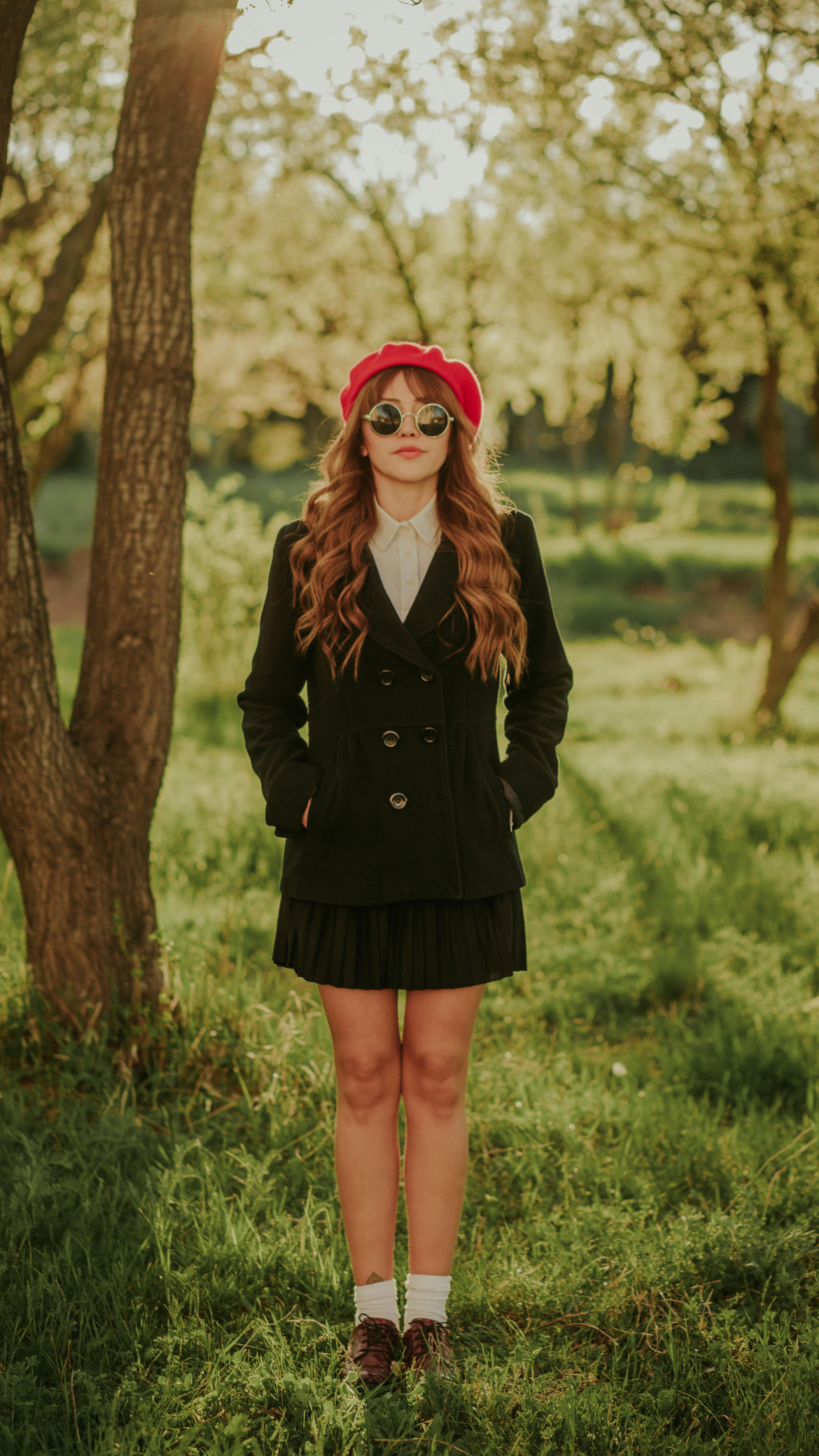 Young Long Haired Woman in Dark Green Pea Coat Pleated Mini