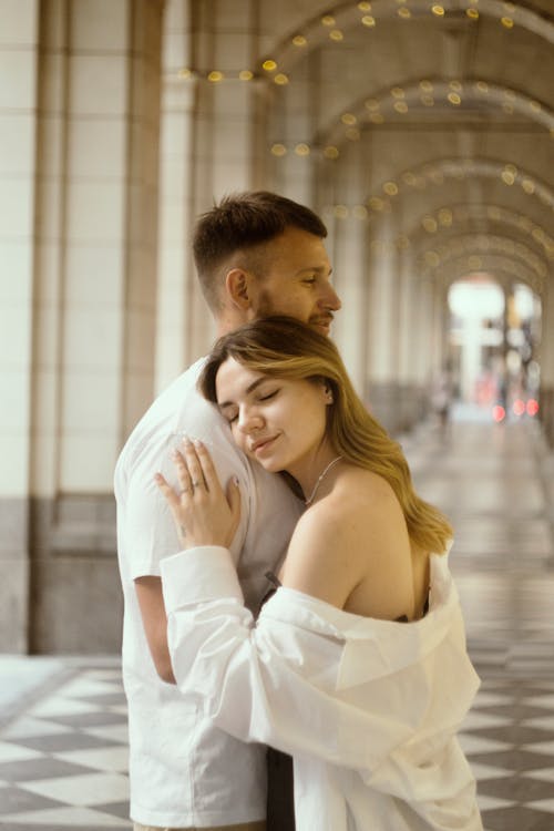 Hugging Couple in the Passage Under the Arches