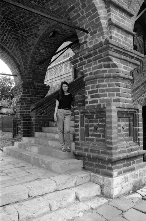 Woman on Stairs of Vintage Building