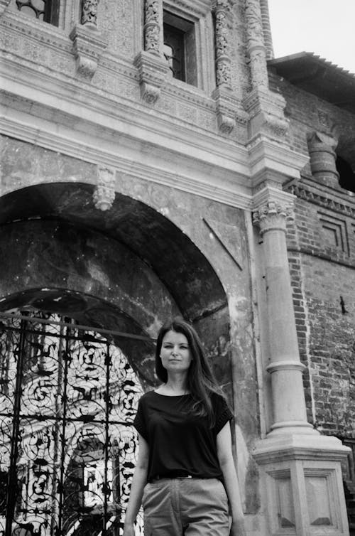 Woman Posing in front of a Historical Building