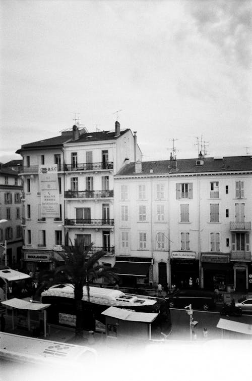 Black and White Photo of a City Street with Buses