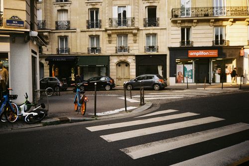 Free Charming Parisian street corner with bicycles and classic buildings in the background. Stock Photo