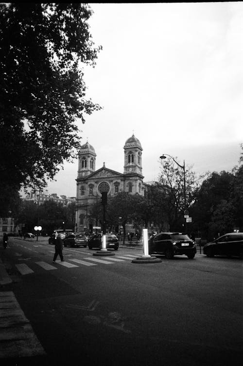 Cars on Street with Church Towers behind