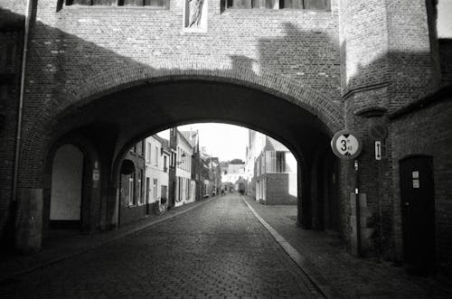 Building Arch over Cobblestone Street