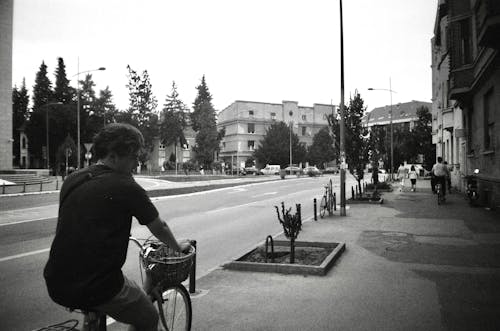 Young Man Riding a Bicycle in City 