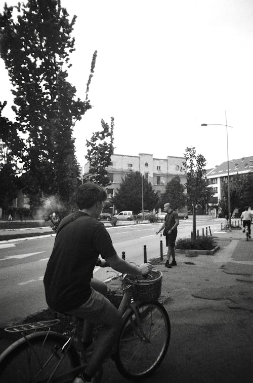 Young Man on a Bicycle in City 