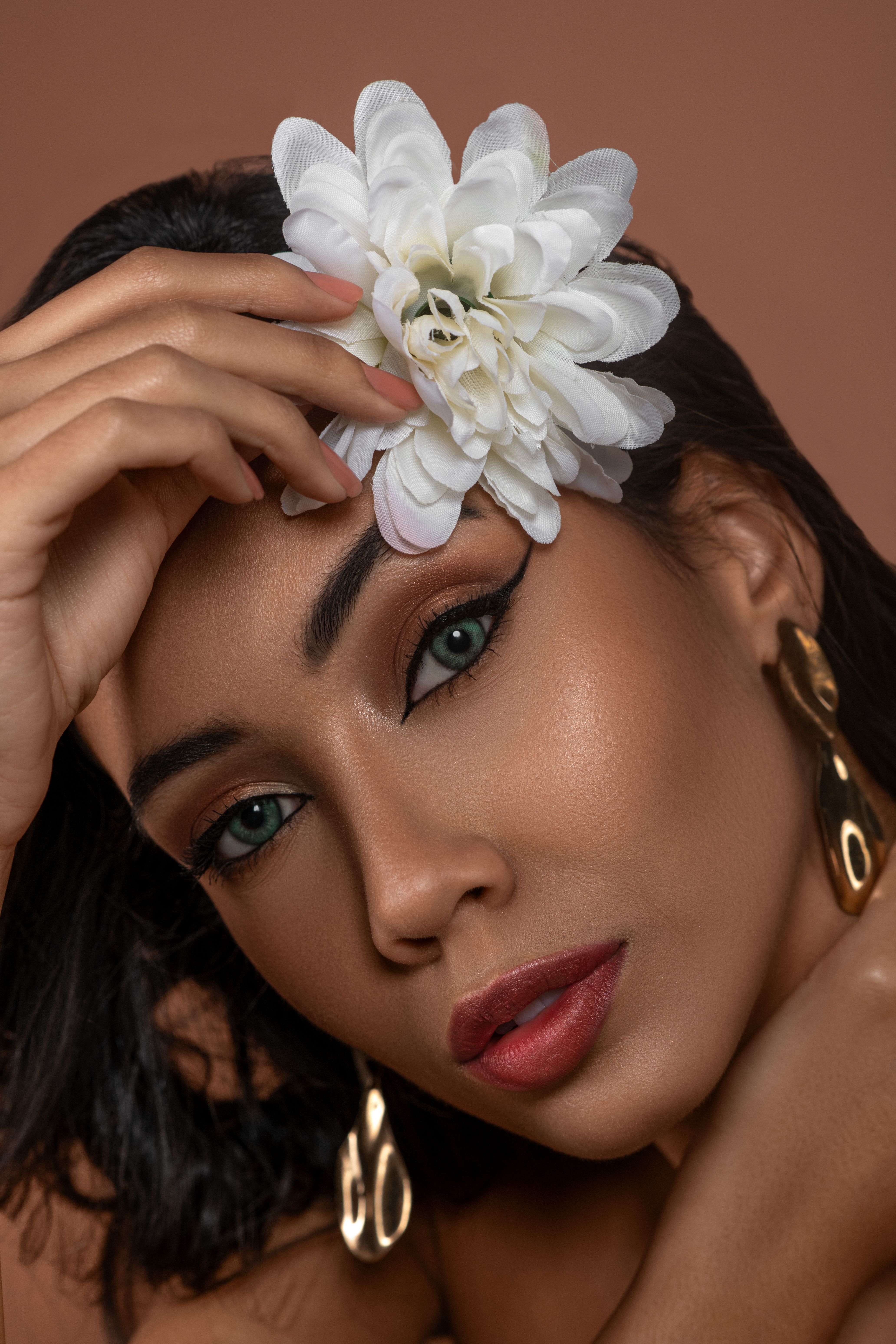 Portrait of a Young Woman with a Flower in her Hair · Free Stock Photo
