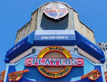 Facade of Bubba Gump Shrimp Co. with vibrant colors and signage under a clear blue sky.