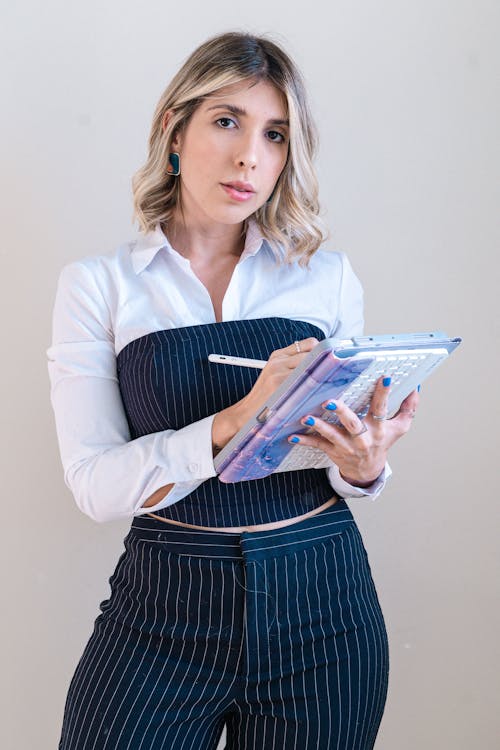 Blonde Woman Making Notes