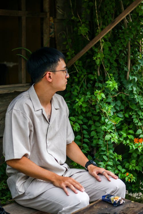 Free Sitting Man in Eyeglasses Stock Photo