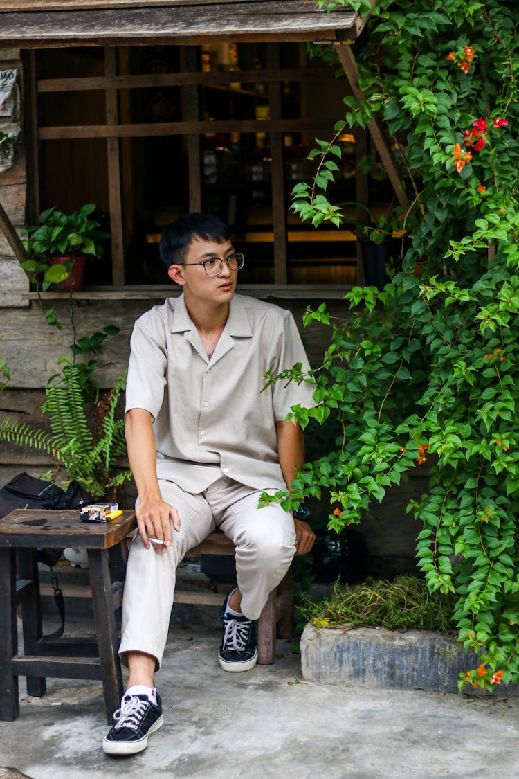 Young Man In Gray Shirt And Pants