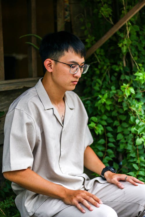 Free Sitting Man in Eyeglasses Stock Photo