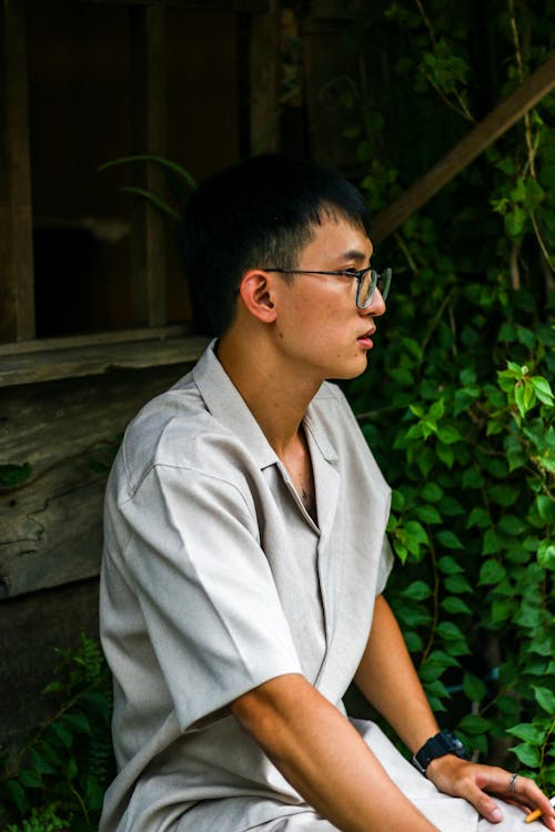 Free Sitting Man in Shirt and Eyeglasses Stock Photo