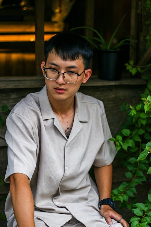 Sitting Man in Eyeglasses