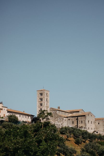 Renaissance architecture of Anagni cathedral against a clear blue sky, capturing historical charm.