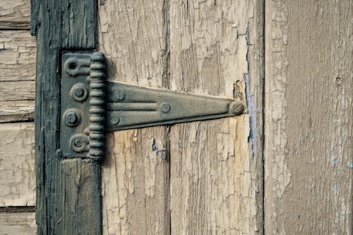 Close up of Hinge on Wooden Planks