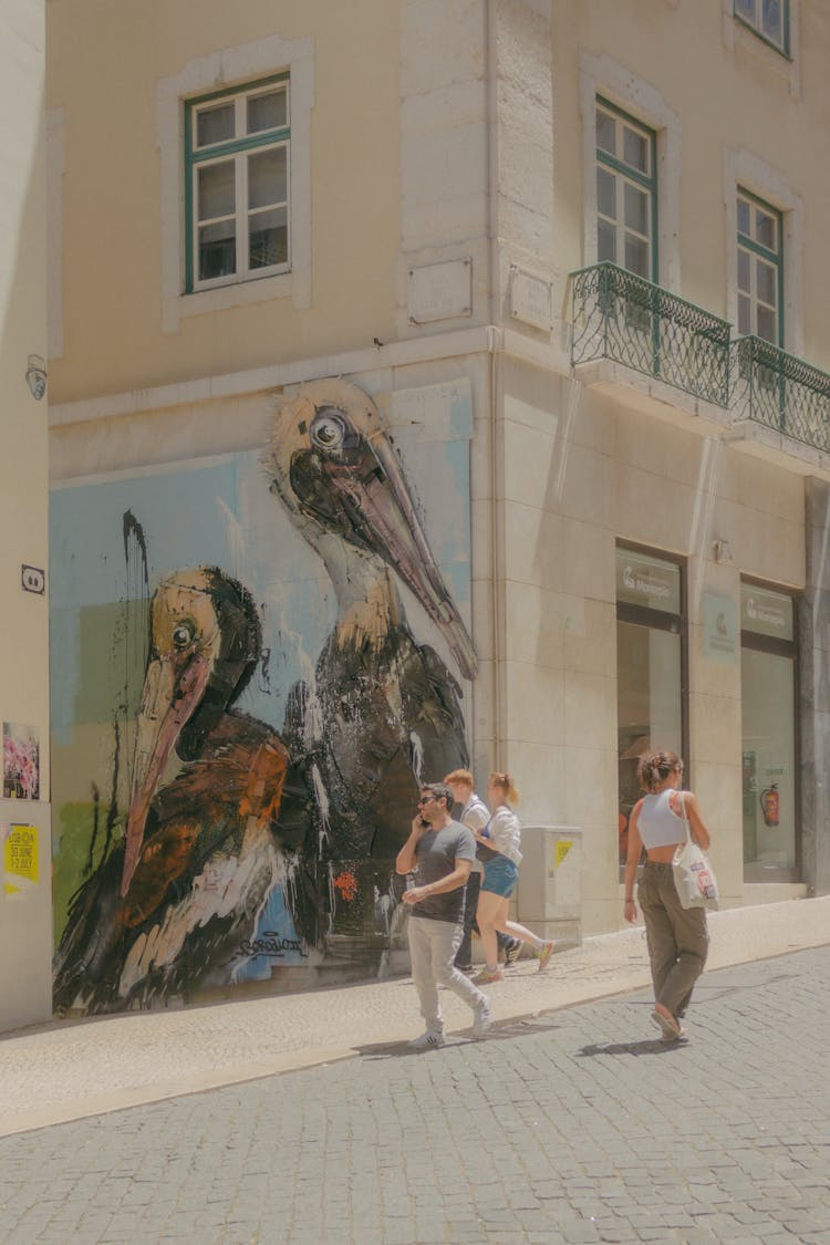 Pelicans Street Art Installation By Bordalo II On A Residential Building In Lisbon, Portugal