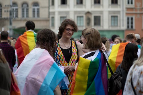 Young People with Rainbow Flags at a Pride Parade 